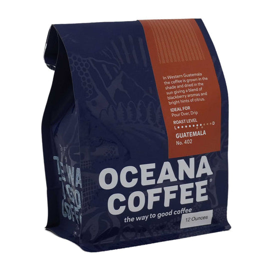 Guatemala Huehuetenango medium roast coffee with tangerine, chocolate, and walnut notes, Rainforest Alliance certified