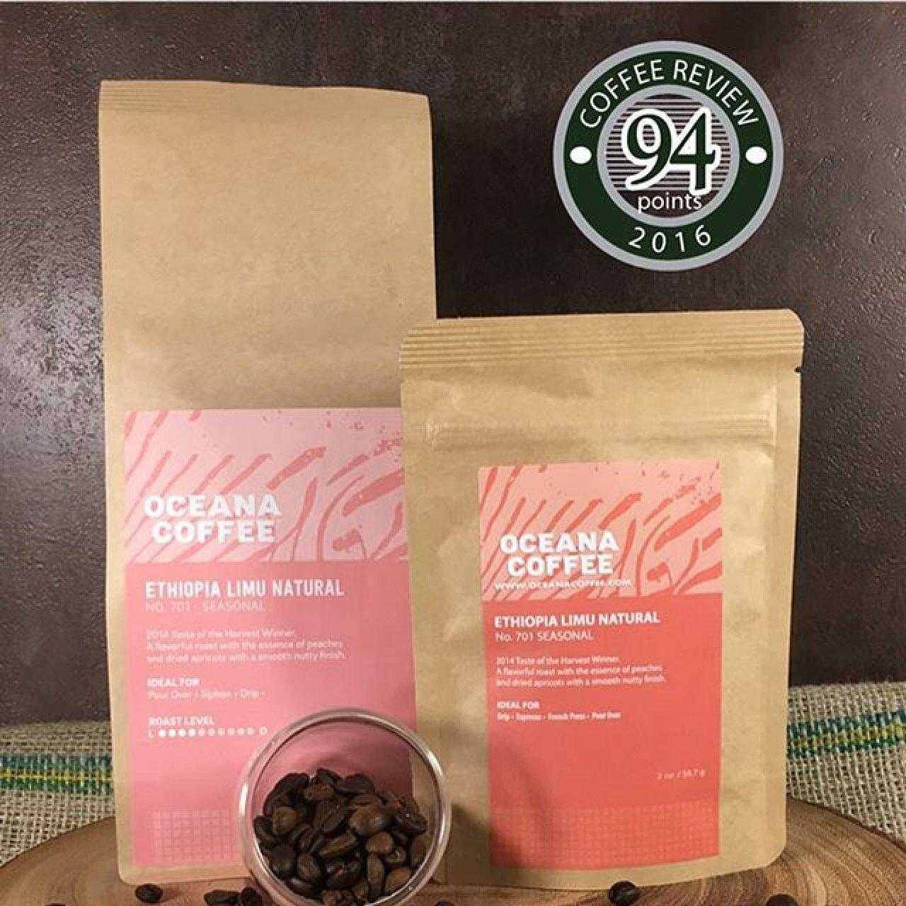 Ethiopia Limu Natural light medium roast coffee by Oceana Coffee with 94 points Coffee Review badge and coffee beans in front