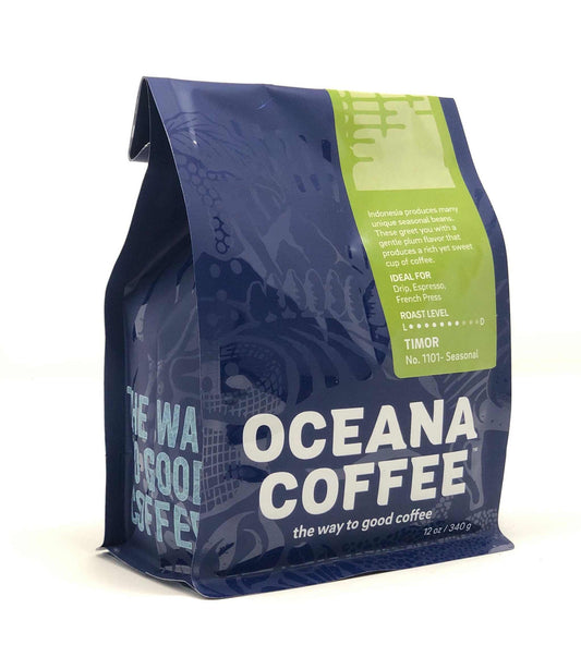 Timor Fair Trade organic coffee beans in Oceana packaging with flavors of dark chocolate, brown sugar, and molasses.